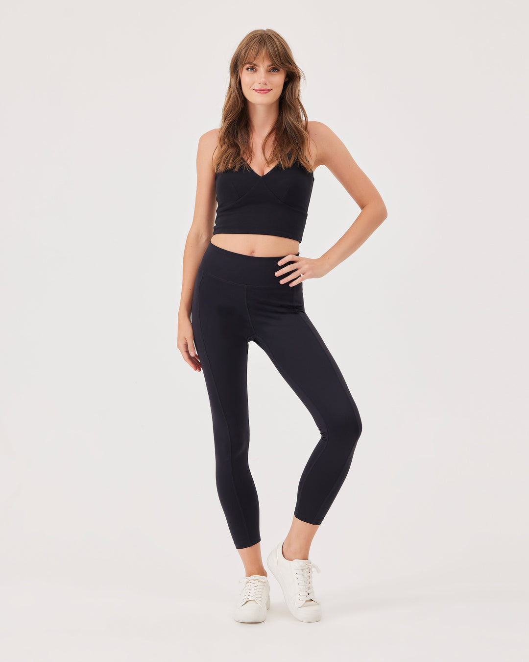 Black criss-cross strap sports bra, V-neckline, crossed straps at the back, fonclo logo on the back, high-quality, super-soft material, crop, strappy, slim fit.