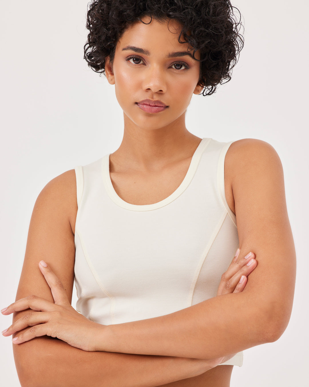 Beige basic tank top with wide straps and Fonclo logo on the back. Crop and round neckline. Perfect for activewear and everyday looks.