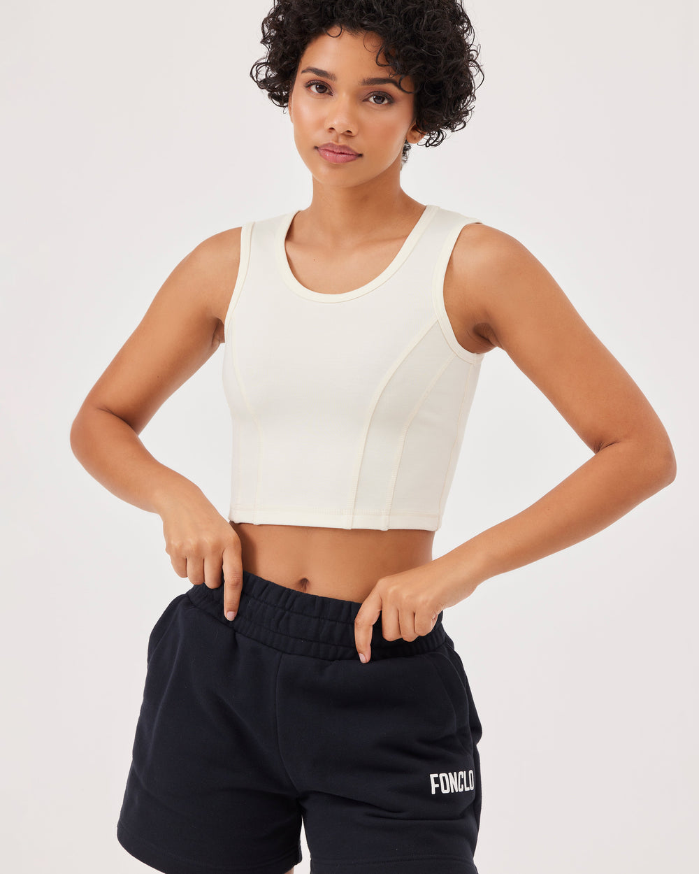 Beige basic tank top with wide straps and Fonclo logo on the back. Crop and round neckline. Perfect for activewear and everyday looks.