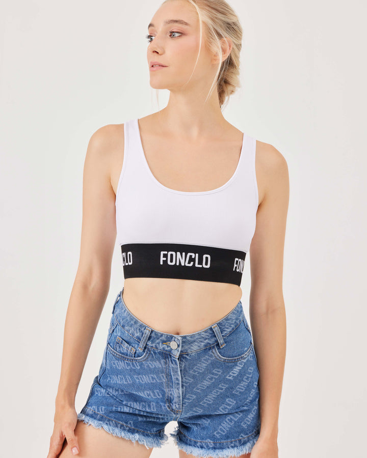 White, ribbed, sports bra, elastic hem, elastic band adorned with fonclo logo, crop, top, sleeveless, stretchy, slim fit. 