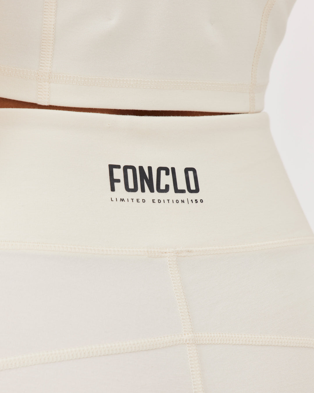 Beige high-waisted ankle-length leggings with Fonclo logo on the back. Made from high-quality stretch fabric. Suitable for gym and daily wear.