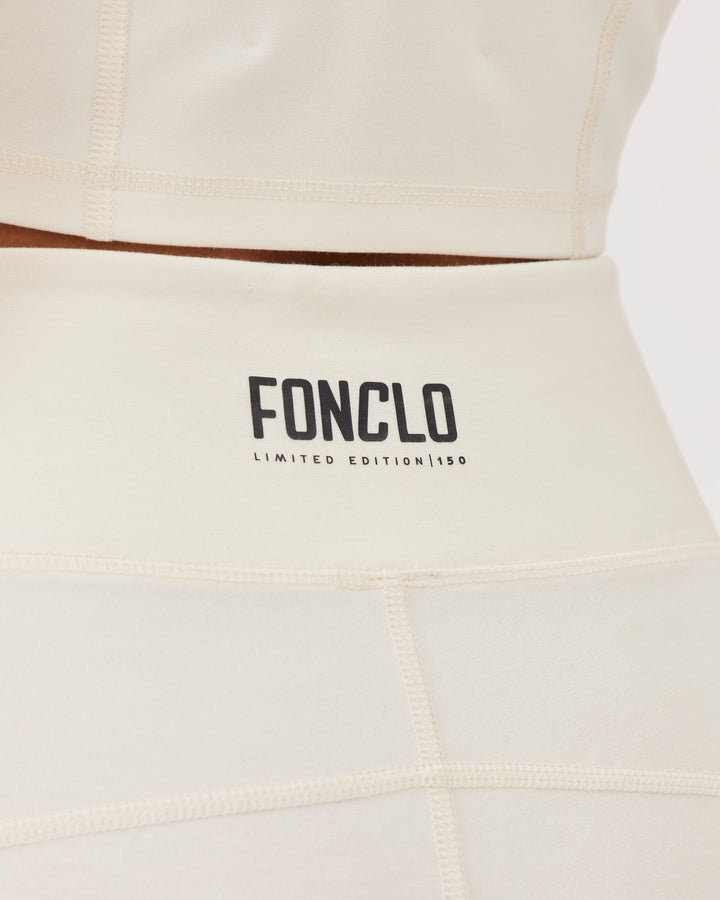 Beige high-waisted ankle-length leggings with Fonclo logo on the back. Made from high-quality stretch fabric. Suitable for gym and daily wear.