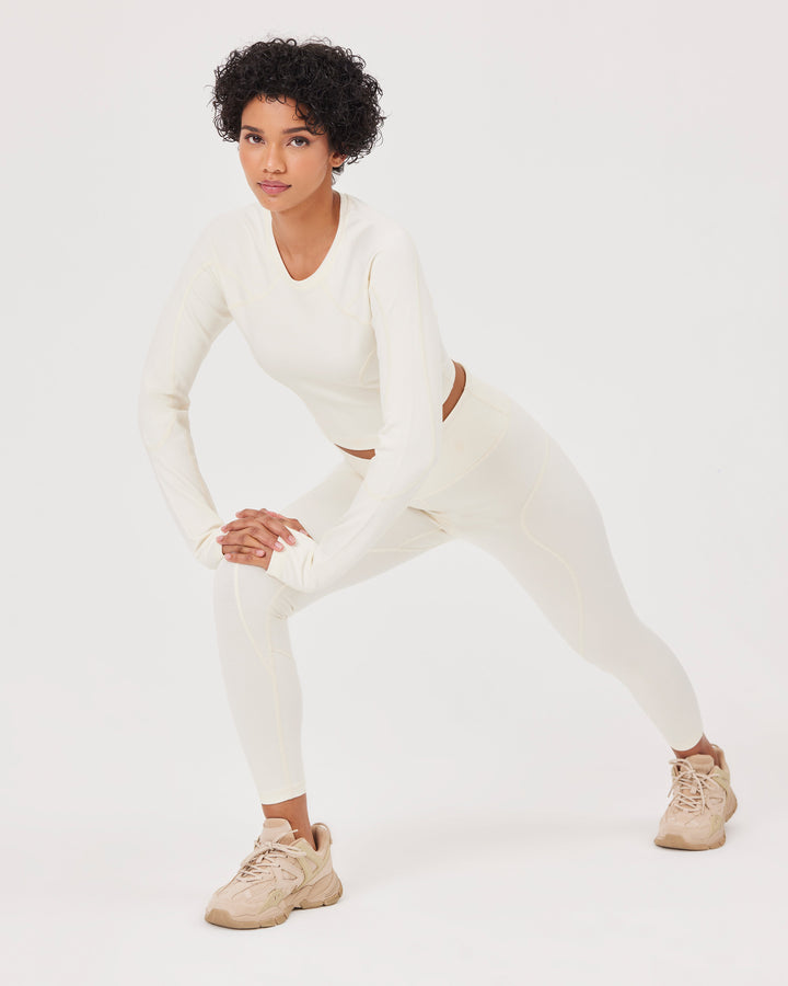 Beige high-waisted ankle-length leggings with Fonclo logo on the back. Made from high-quality stretch fabric. Suitable for gym and daily wear.