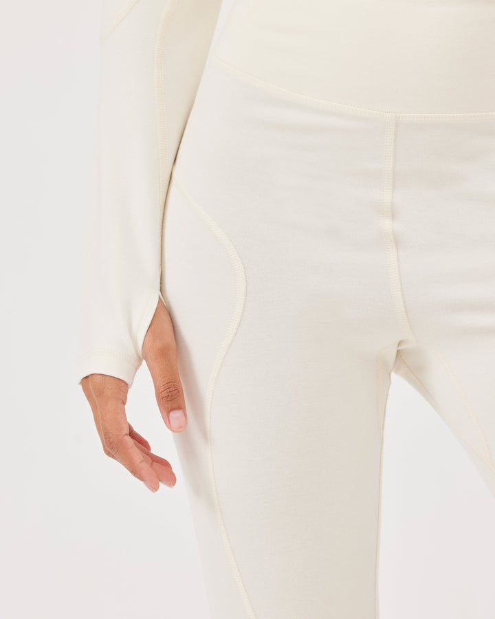 Beige high-waisted ankle-length leggings with Fonclo logo on the back. Made from high-quality stretch fabric. Suitable for gym and daily wear.