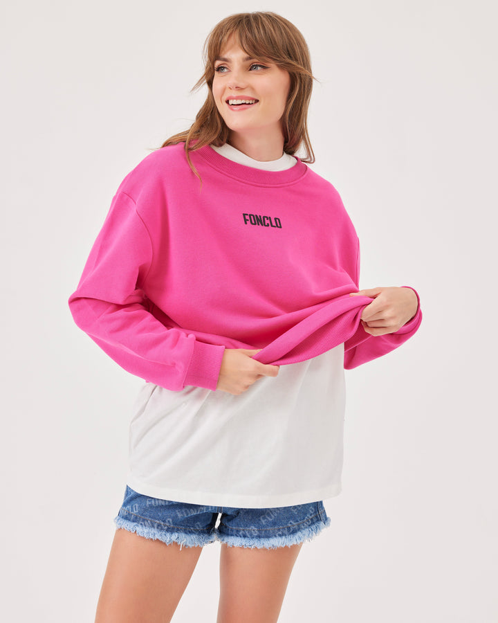 Pink, basic sweatshirt, fonclo logo on the front, long sleeves, dropped shoulders, round neckline. Ribbed cuffs on the sleeves, hem, and neckline, soft material, overBeden.