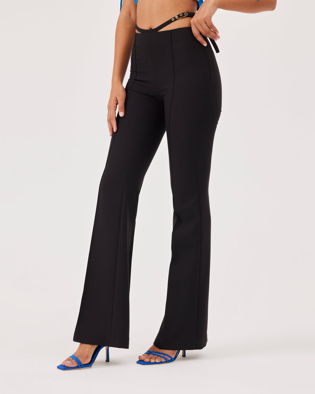 Black, high-waist trousers, belt detail at the waist, slim fit, flared and wide legs, front and back creases,side zipper, pants, elegant. 