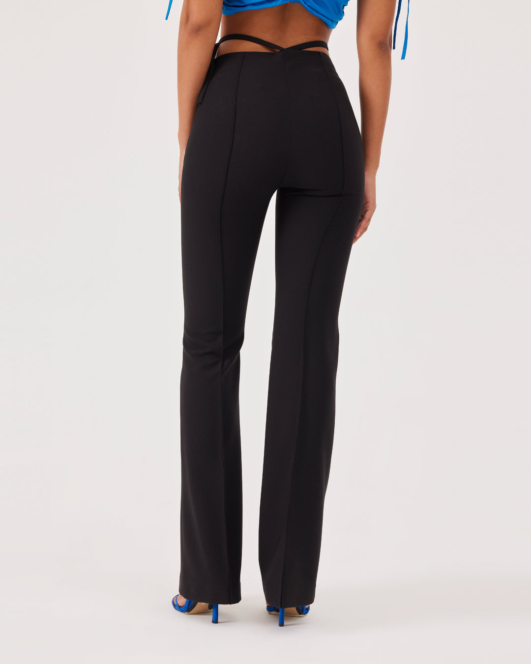 Black, high-waist trousers, belt detail at the waist, slim fit, flared and wide legs, front and back creases,side zipper, pants, elegant. 