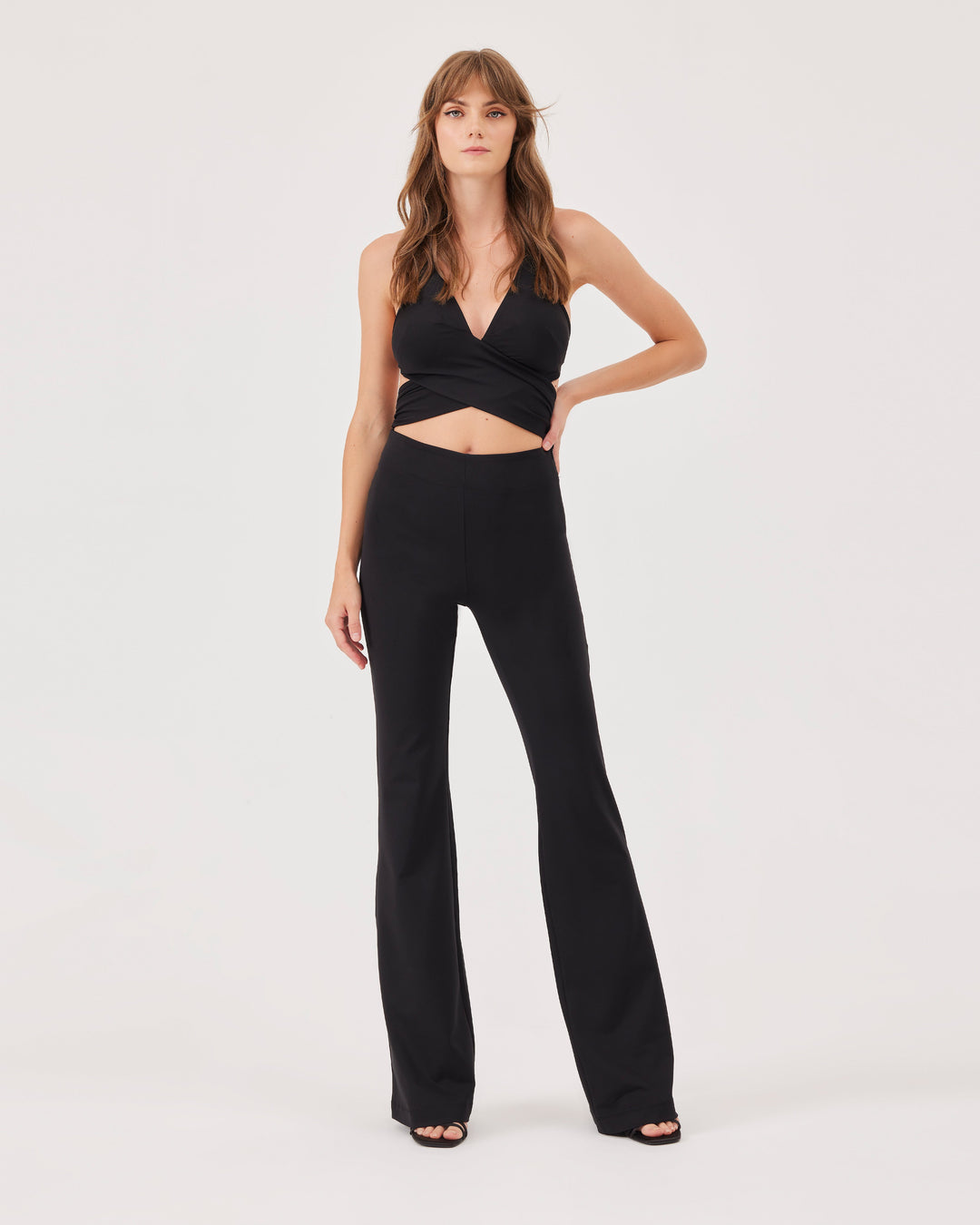 Black, halterneck, jumpsuit, overall, flared leg cut, tie bands, long, slim fit, v-neck, open back, cut-outs, stretchy. 